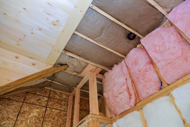 covering-view-layers-pink-fiberglass-insulation-cold-barrier