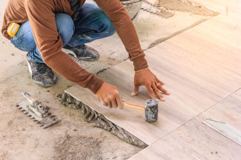 home-improvement-renovation-construction-worker-tiler-is-tiling