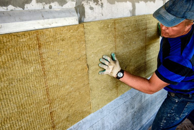 worker-insulates-house-with-mineral-wool-slabs-internal-thermal-insulation-walls-with-mineral-wool
